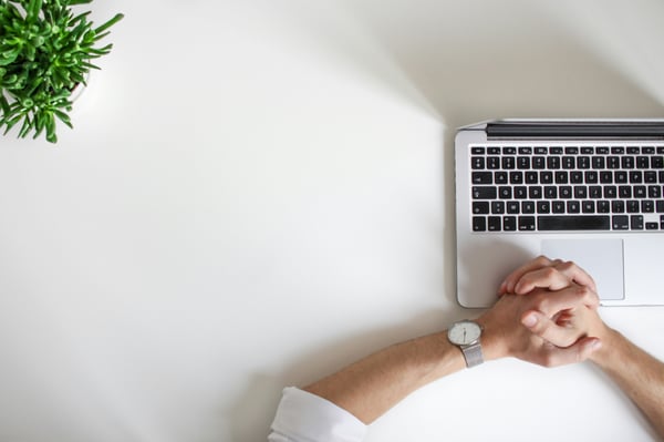 A person sitting at a laptop 