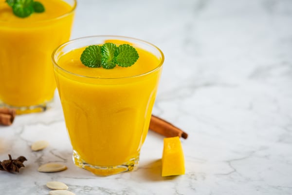 two-glasses-pumpkin-juice-place-white-marble-floor